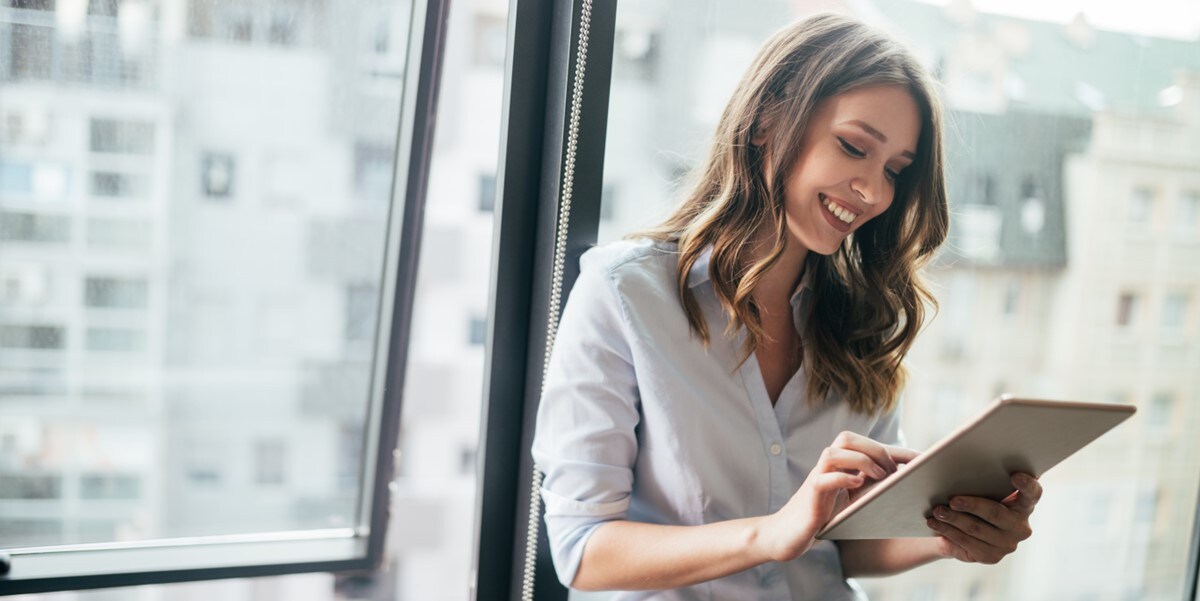woman in the office holding a tablet