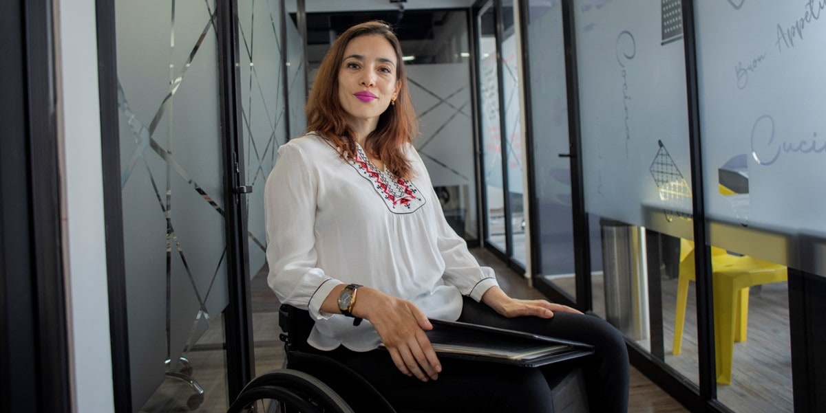 woman in the office, using wheelchair