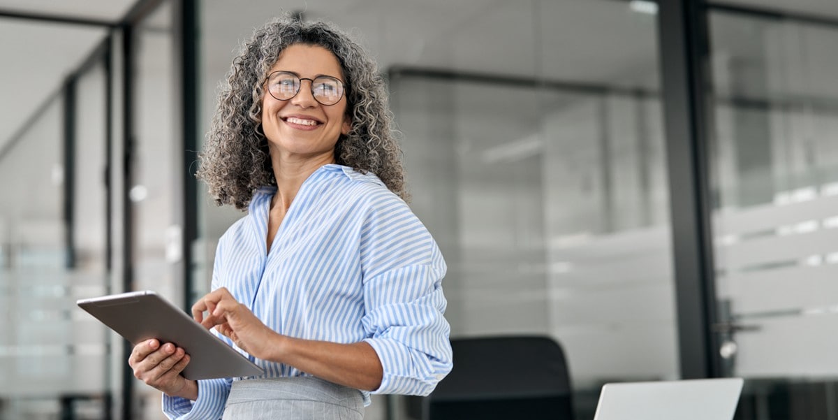 woman in the office holding a tablet