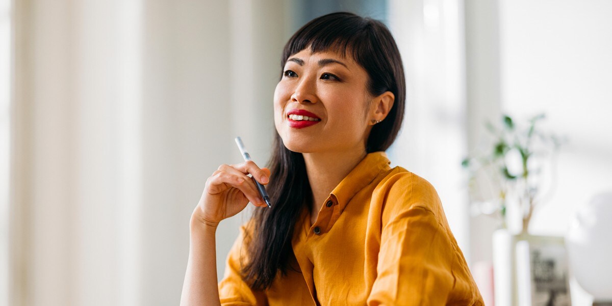 professional woman smiling, in the office