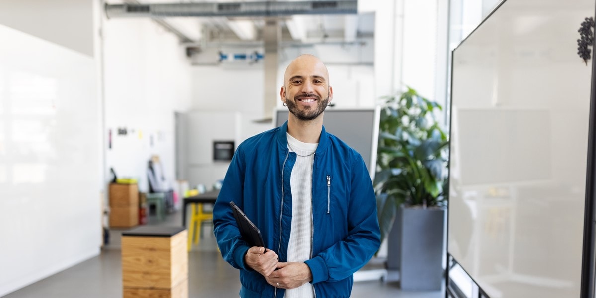 professional man in office with laptop
