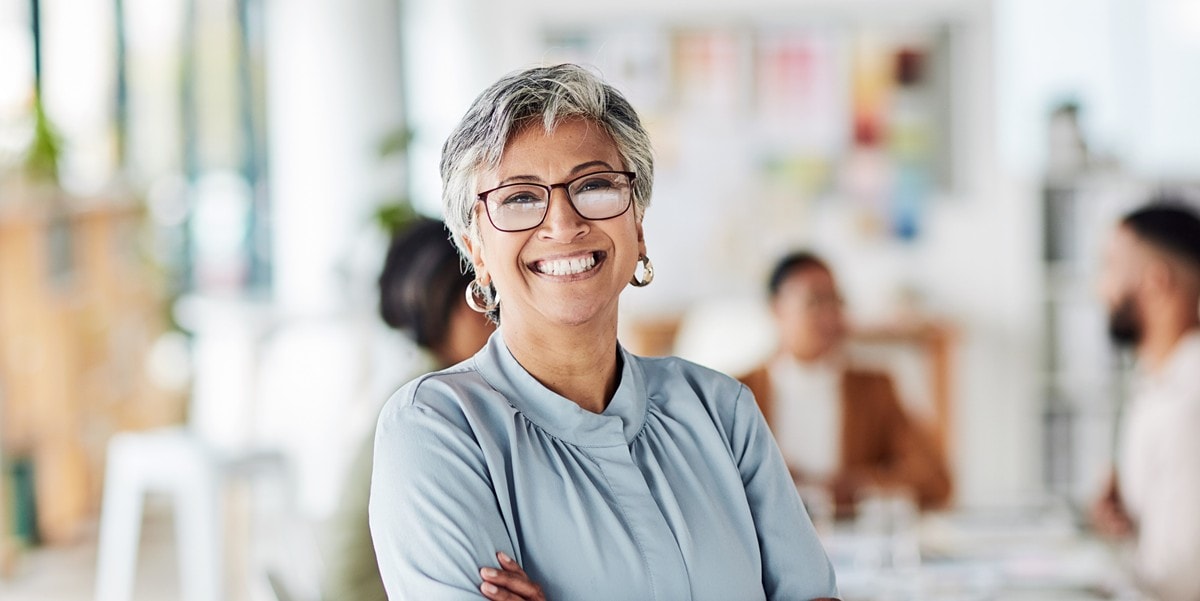 professional woman smiling, in the office