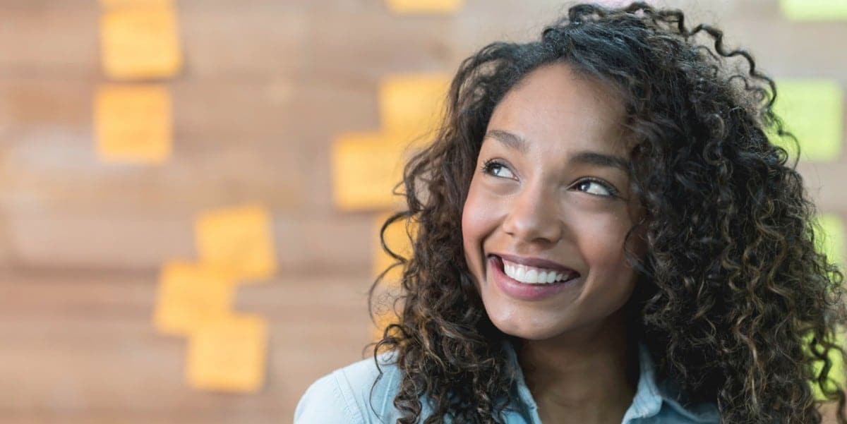 woman smiling, in the office