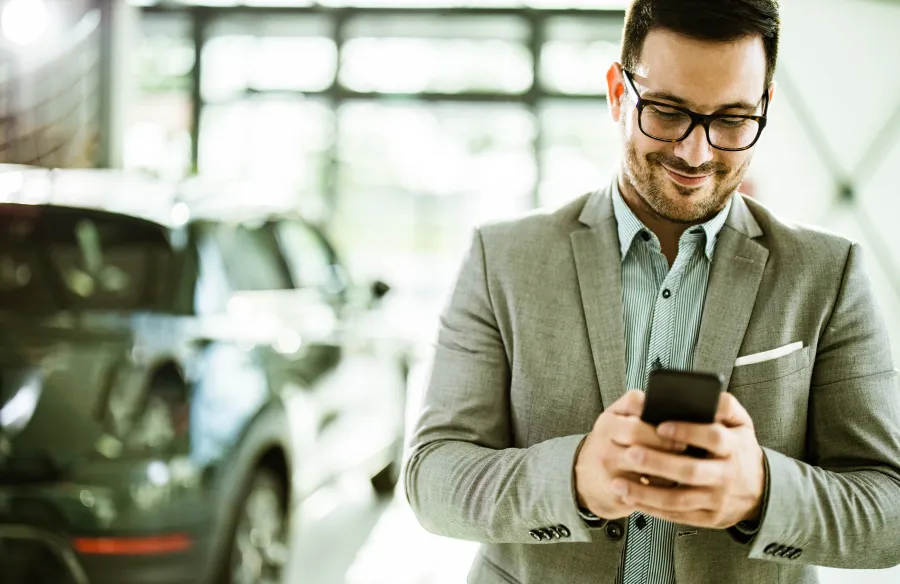 man using app on his phone for travel